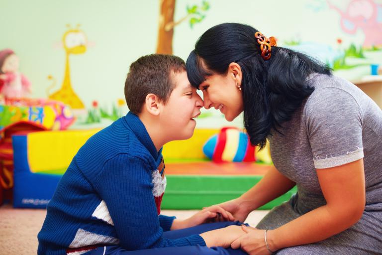 child and adult playing