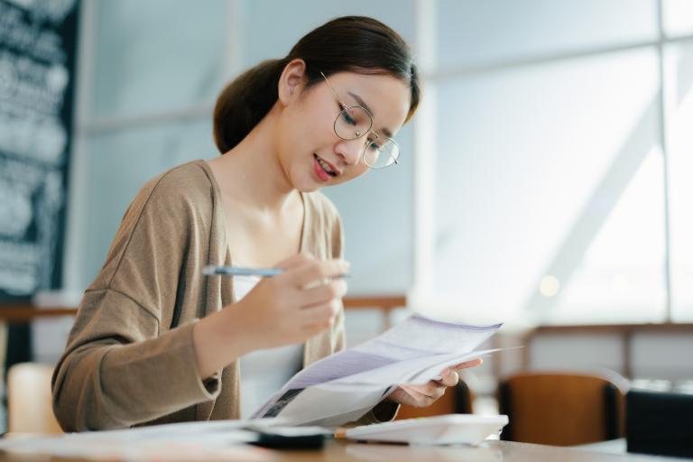 lady signing papers