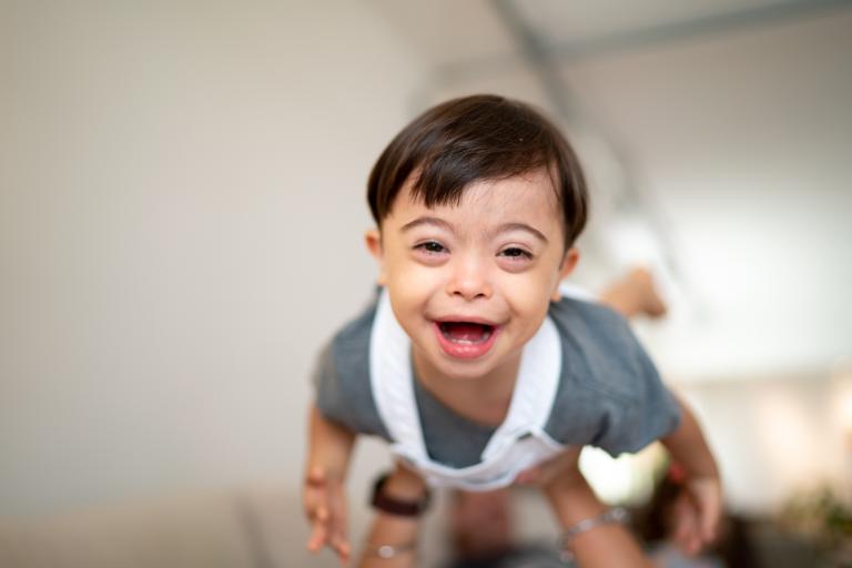 toddler boy laughing