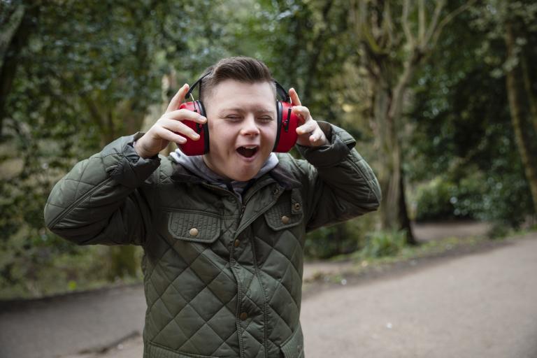 teenager with ear defenders