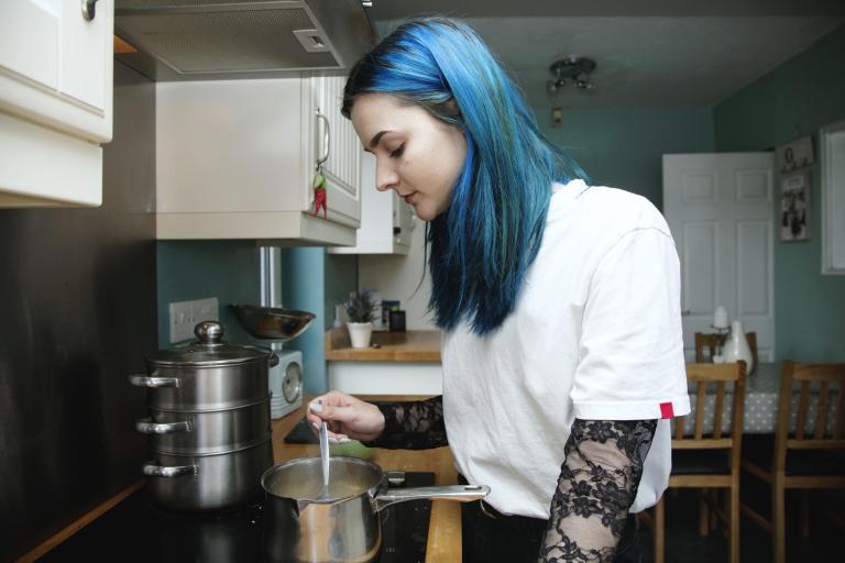 Girl in kitchen cooking