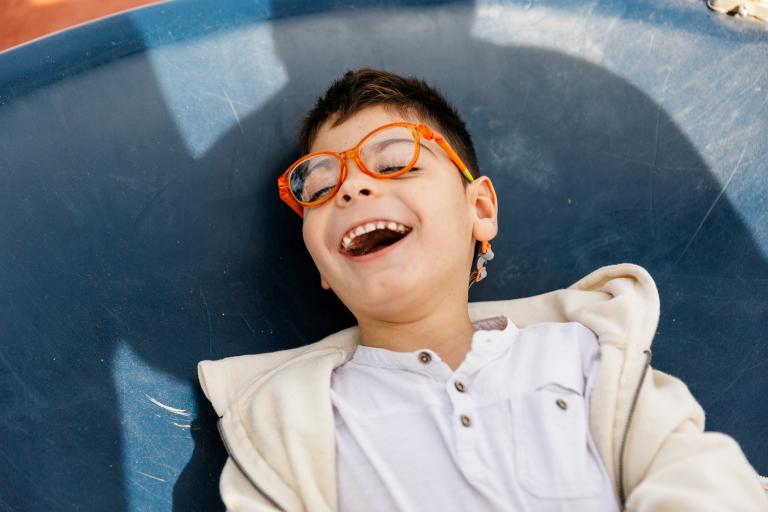 young boy laughing