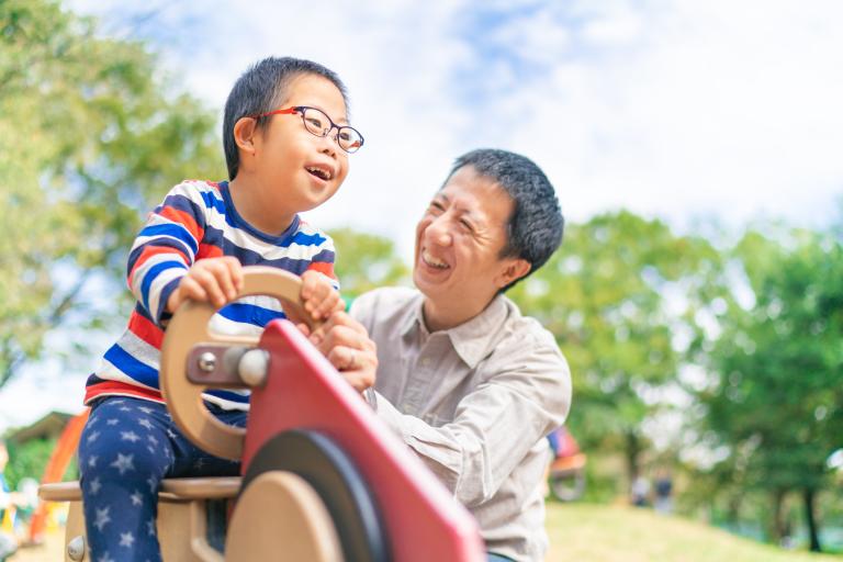 boy and dad in park