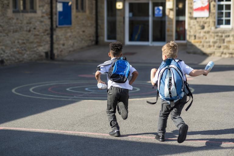 boys running into school