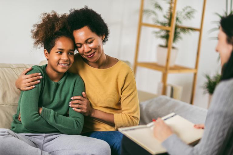 parent and young person talking to adult 