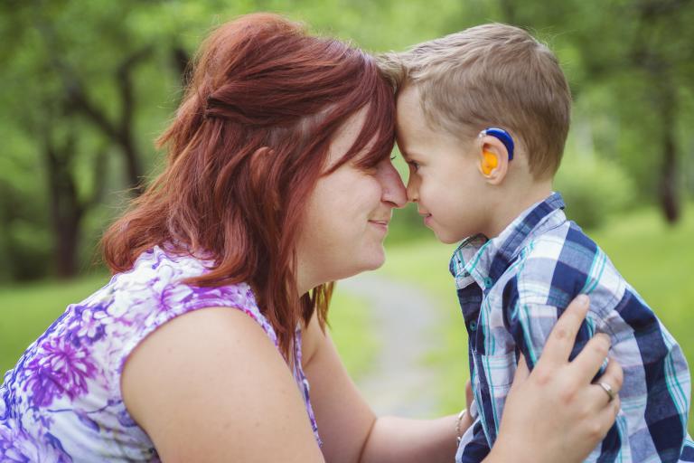 mum and child w hearing aid