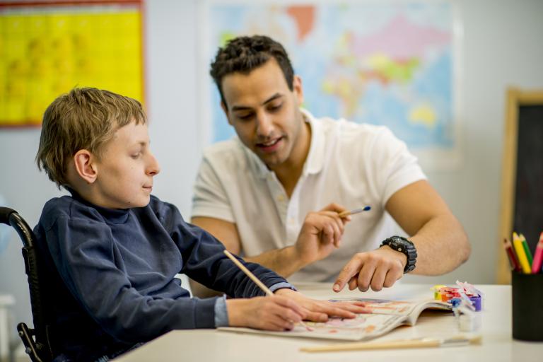 boy in wheelchair learning