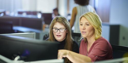 YP and adult looking at computer screen