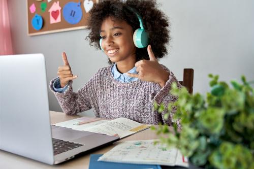 child, laptop and headphones
