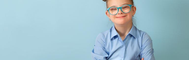 girl smiling in blue shirt