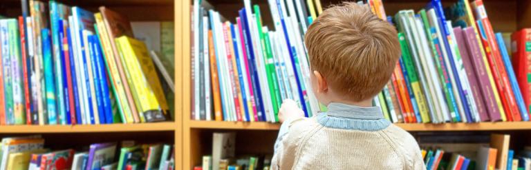 boy looking at books